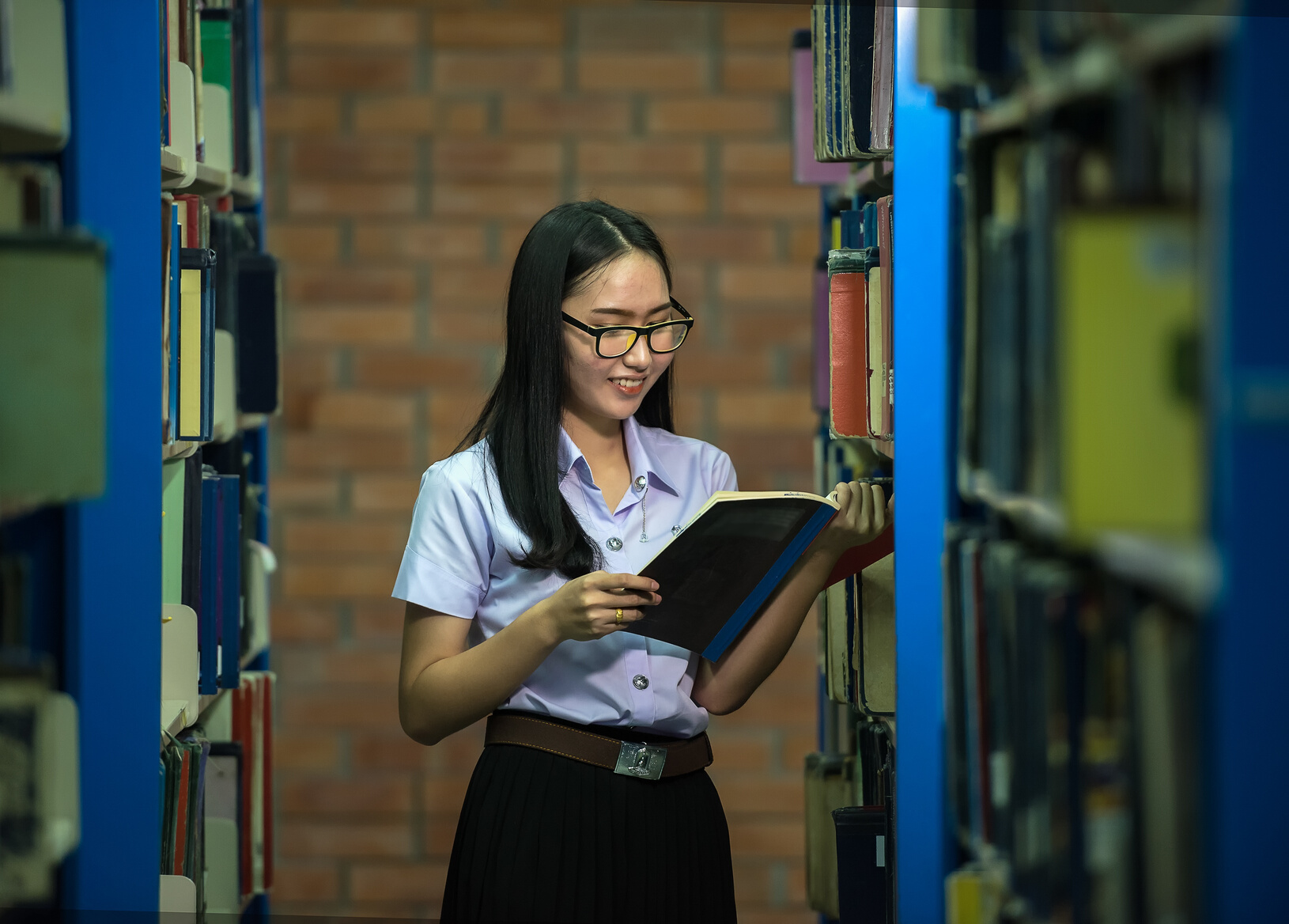 Student in Library Doing Research